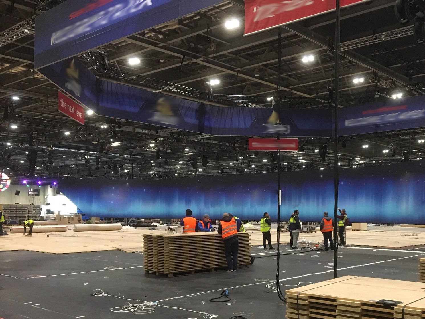 A group of people are working in a large building.