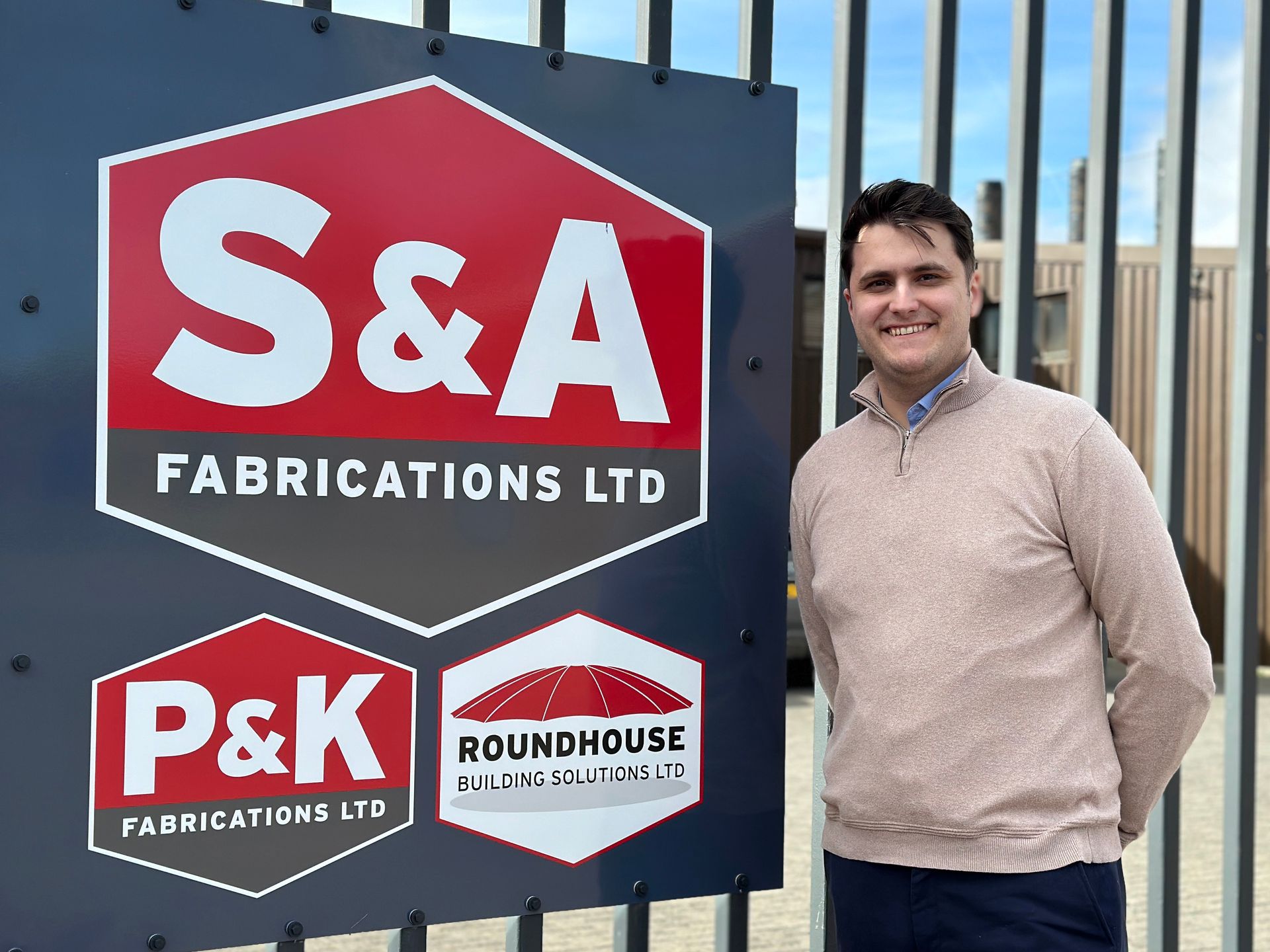 Martin Worthington standing in front of a sign that says s & a fabrications ltd