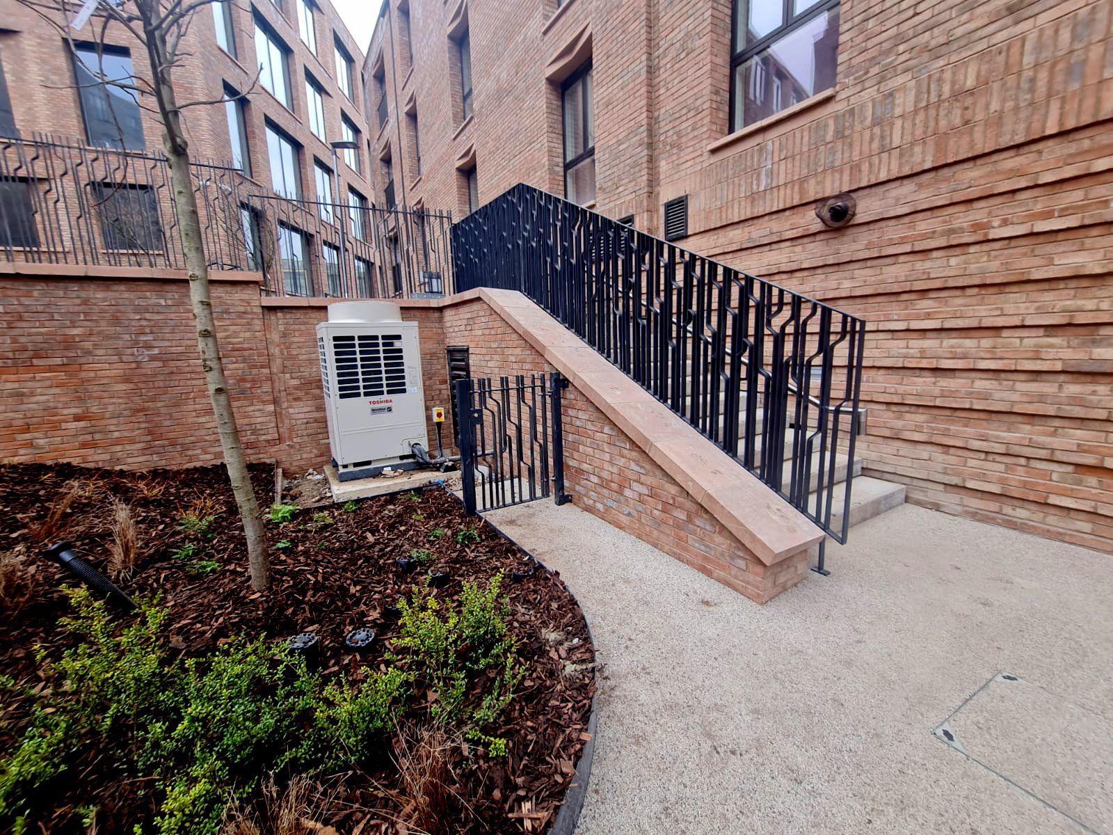 A brick building with stairs leading up to it.