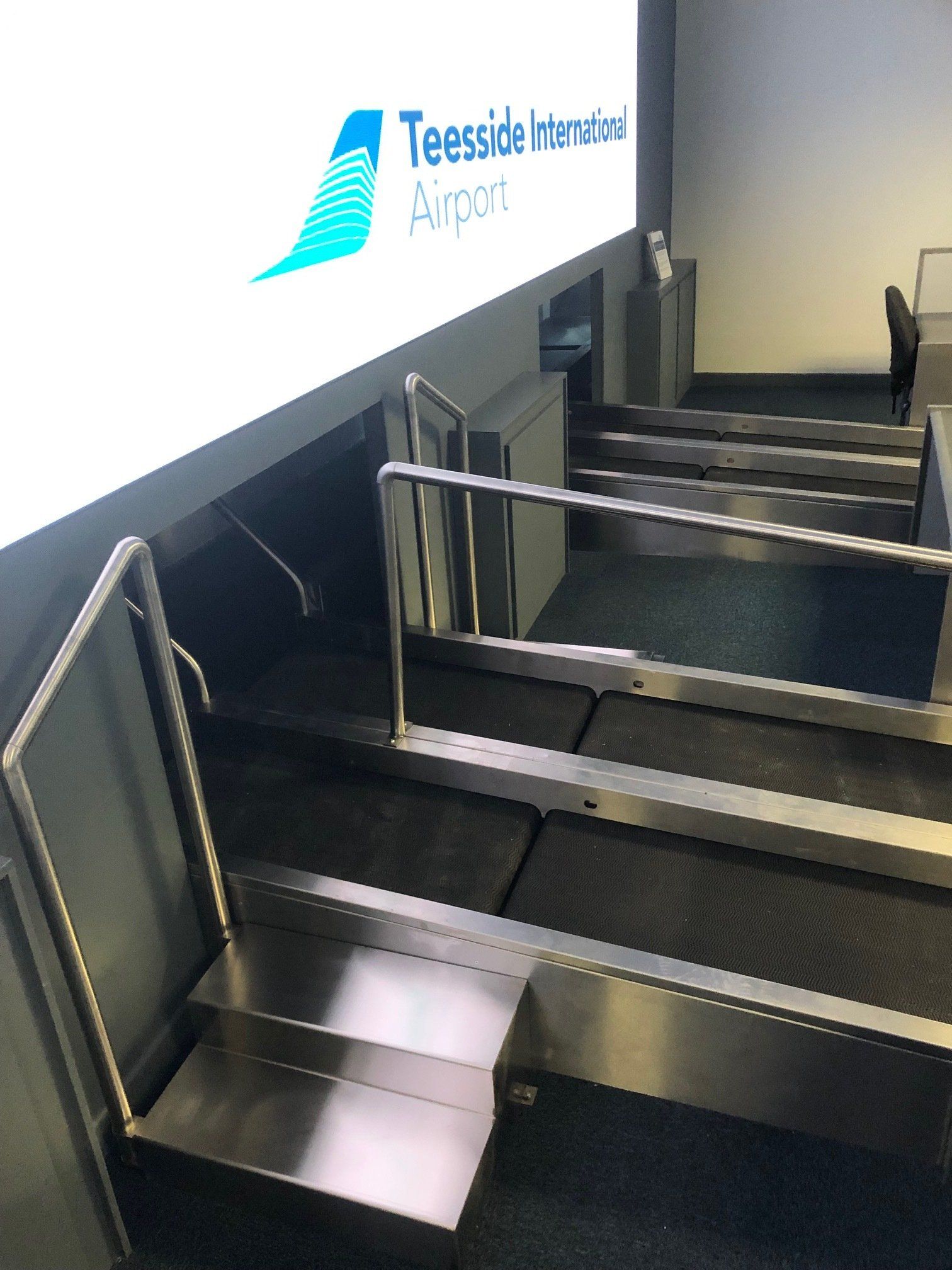A row of baggage claim belts at teesside airport