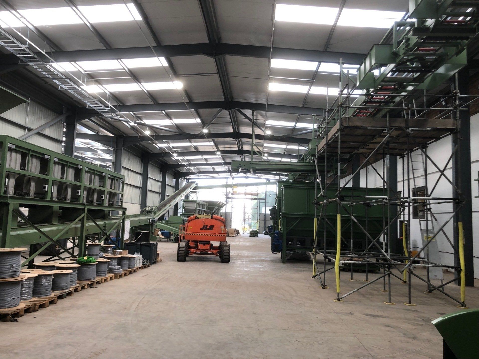 A large warehouse with a lot of machinery in it