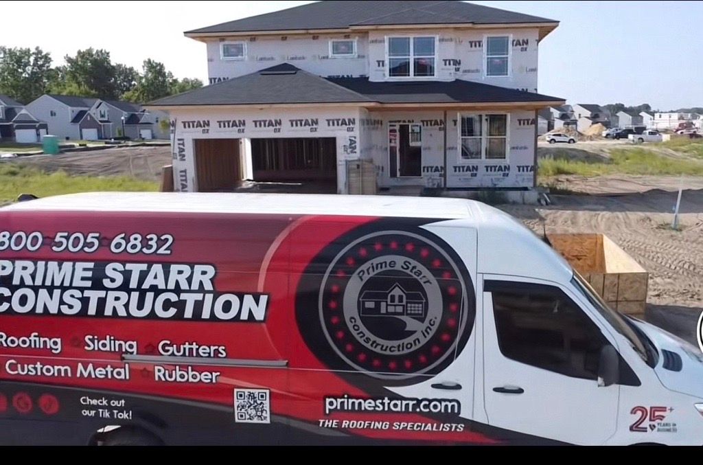 Construction van with “Prime Starr Construction” parked in front of a house under renovation Construction van with “Prime Starr Construction” parked in front of a house under renovation