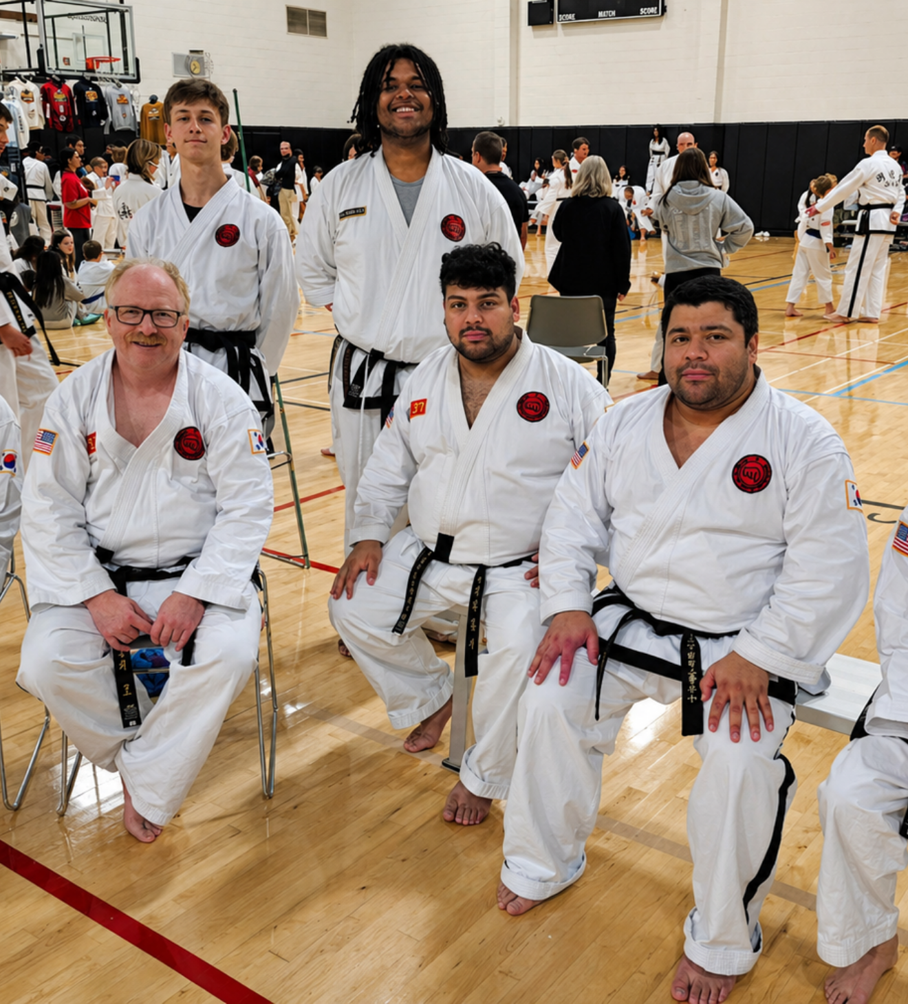 a group of instructors posing at a tournament