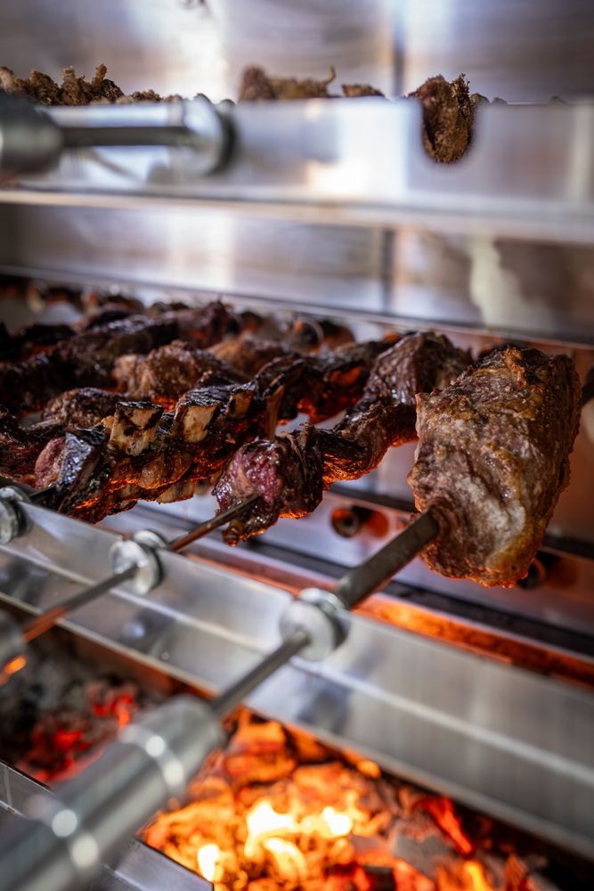 Roasted Meat Skewers Over Glowing Coals — CQ Butchers & Catering Supplies in Mackay, QLD