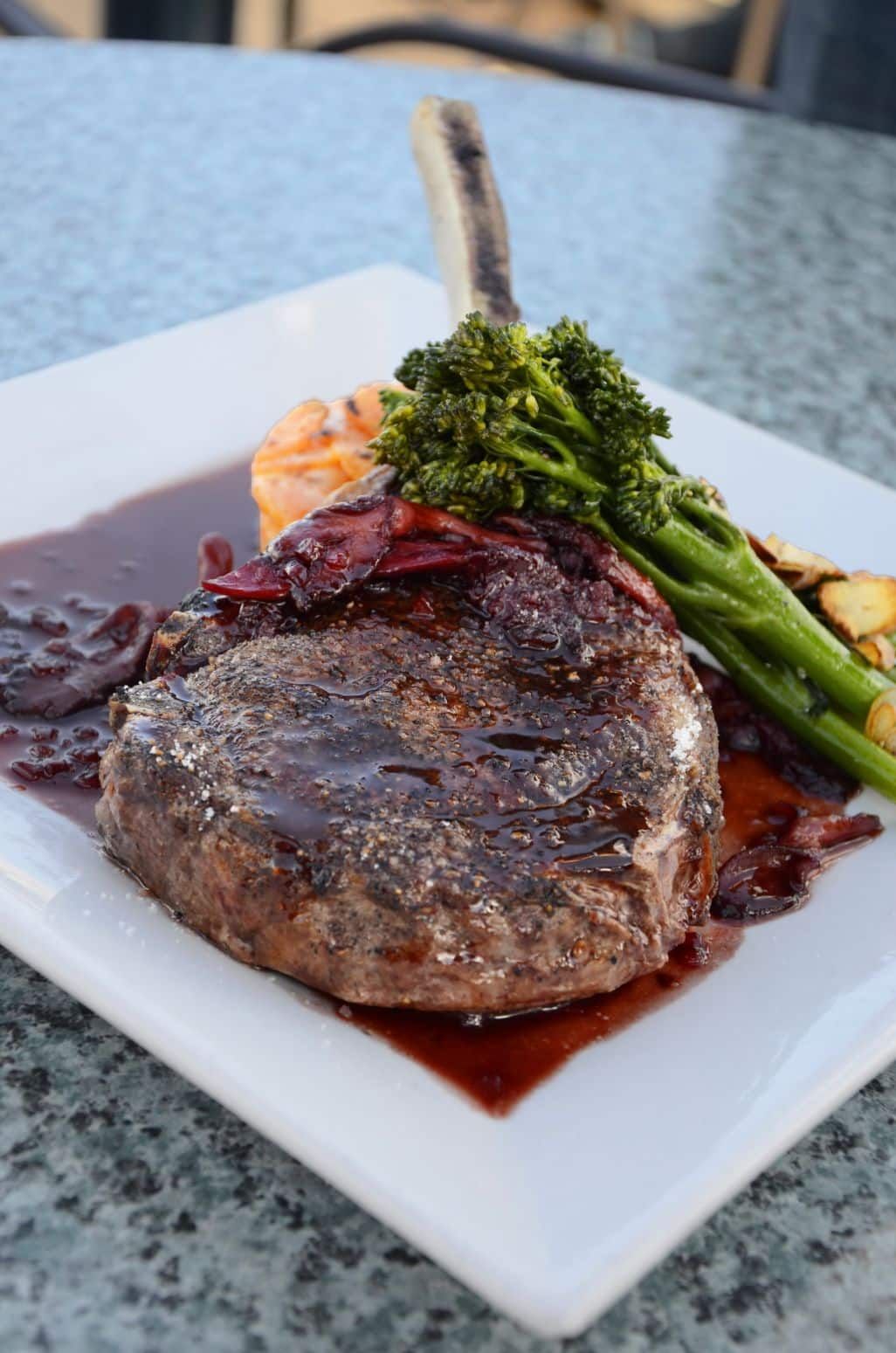 A Plate With a Steak, Sauce, Vegetables and a Potato — CQ Butchers & Catering Supplies in Mackay, QLD