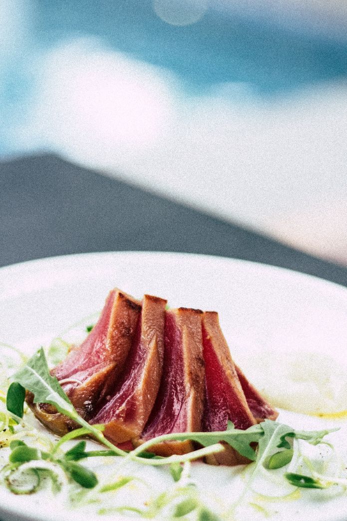 Seared Tuna Slices on a Plate With Greens — CQ Butchers & Catering Supplies in Mackay, QLD