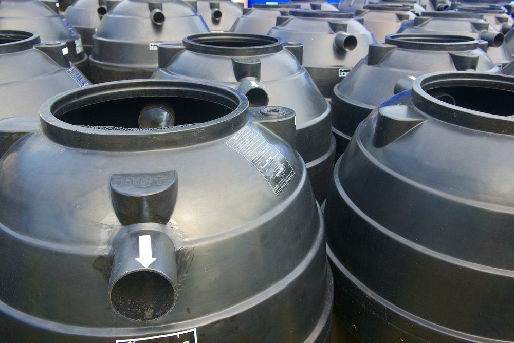 Black Plastic Water Storage Tanks Outdoor — Barney’s Tank Cleaning in Morisset, NSW