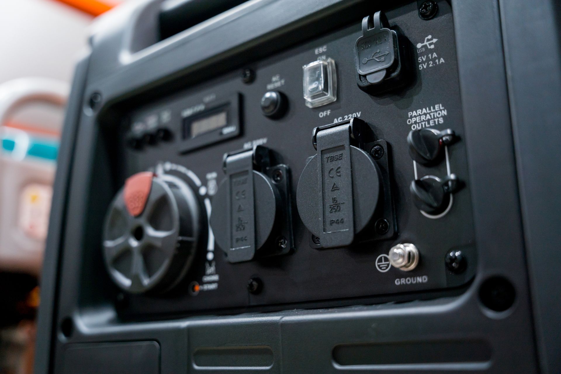 Close-up of a car dashboard control panel with knobs, switches, and a radio display