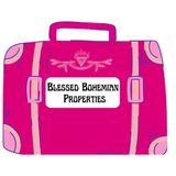 Pink suitcase graphic with “Blessed Bohemian Properties” logo on front