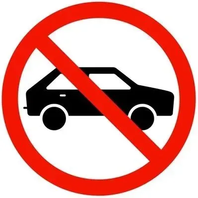 A red circle with a black car in it