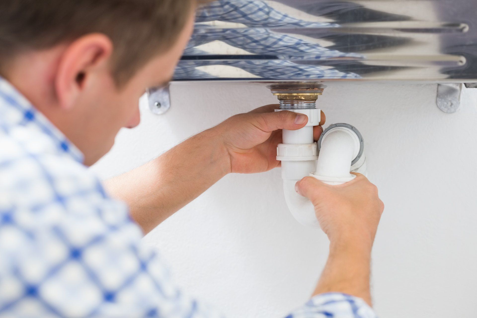 Man Inspecting A Broken Pipe — San Jose, CA — Alert Plumbing, Inc.
