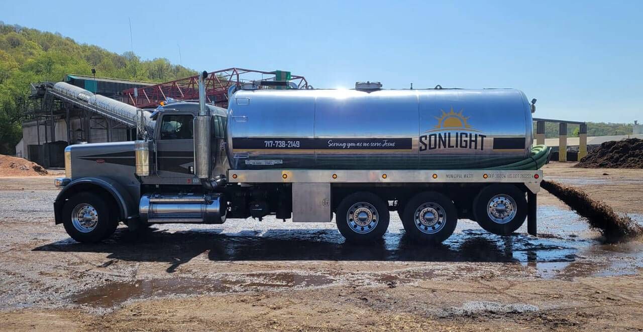Sonlight Services technician preparing a septic system for fall and winter