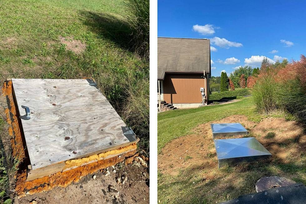 Concrete utility slabs beside a house, including a small metal cover and a larger slab in the ground.