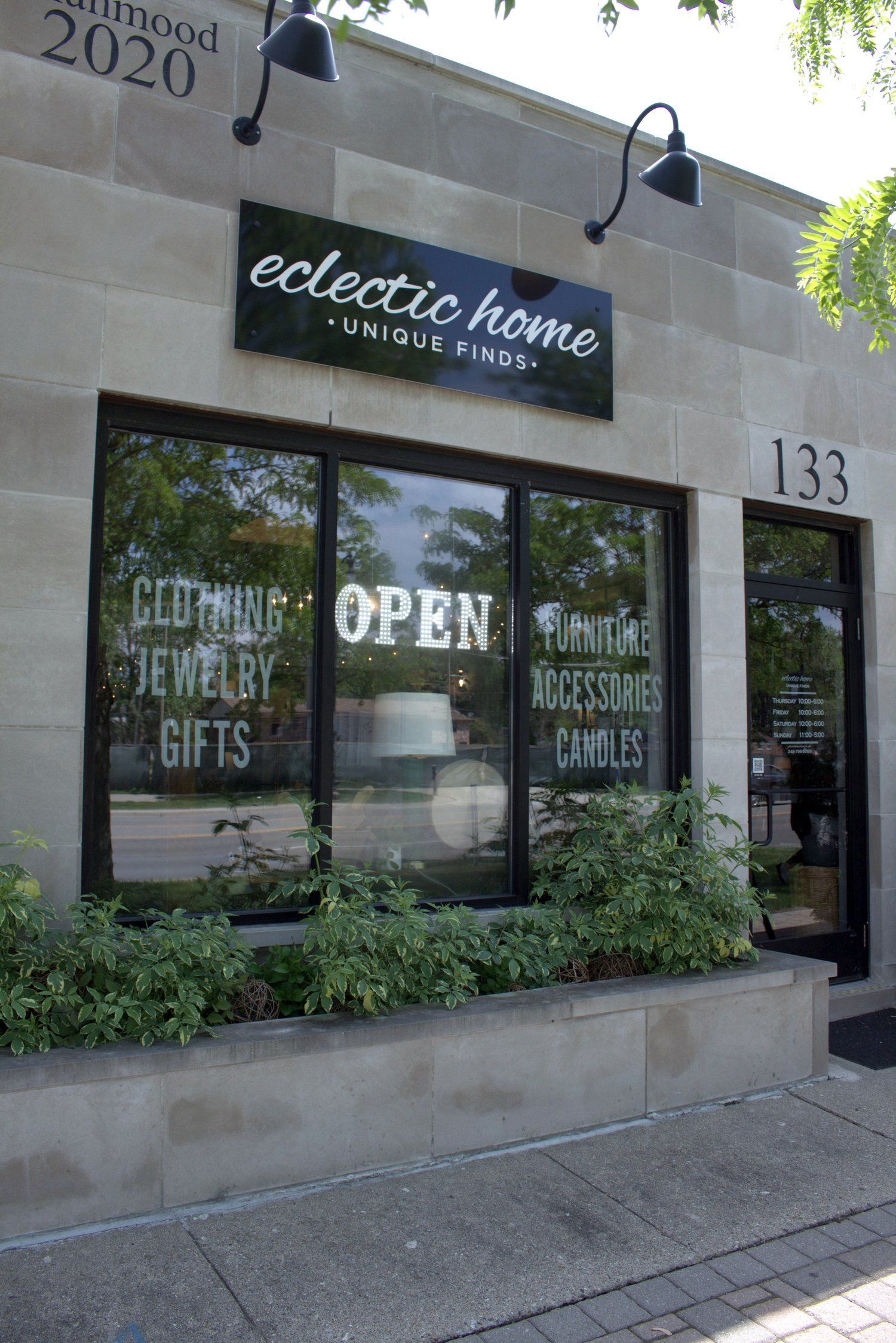 A store front with a sign that says `` eclectic home '' on it.