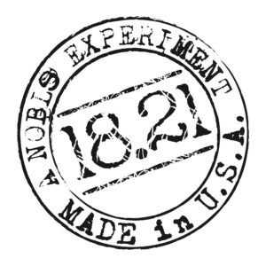 Black circular rubber stamp reading “18.21” and “EXPERIMENT MADE IN U.S.A.”
