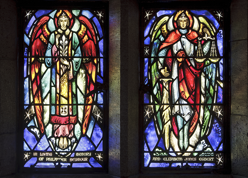 Two stained glass windows: angels, robes, and wings; vibrant colors of blue, red, yellow, and green.