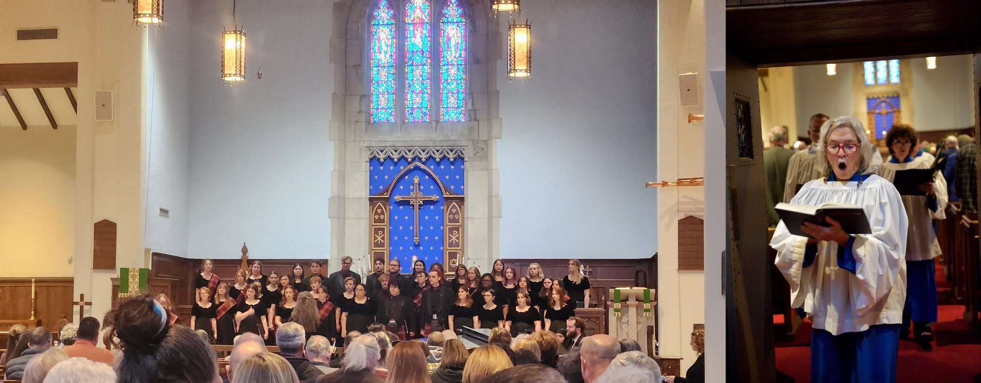 Choir performing in a church, featuring a stained glass window. Audience seated. Singers wear robes.