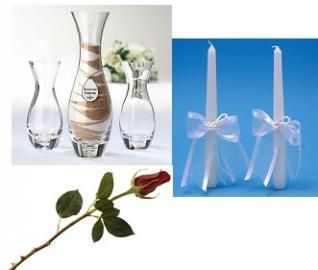 Assorted decorative vases and two blue candles tied with white ribbon, plus a red rose stem