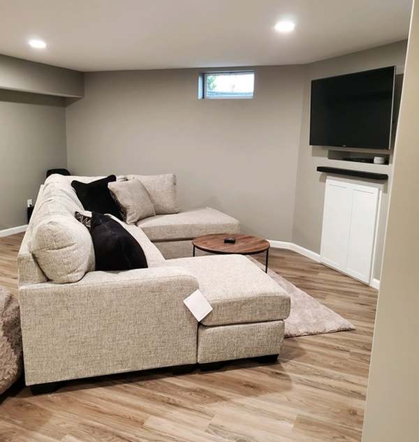 A living room with a couch and a flat screen tv