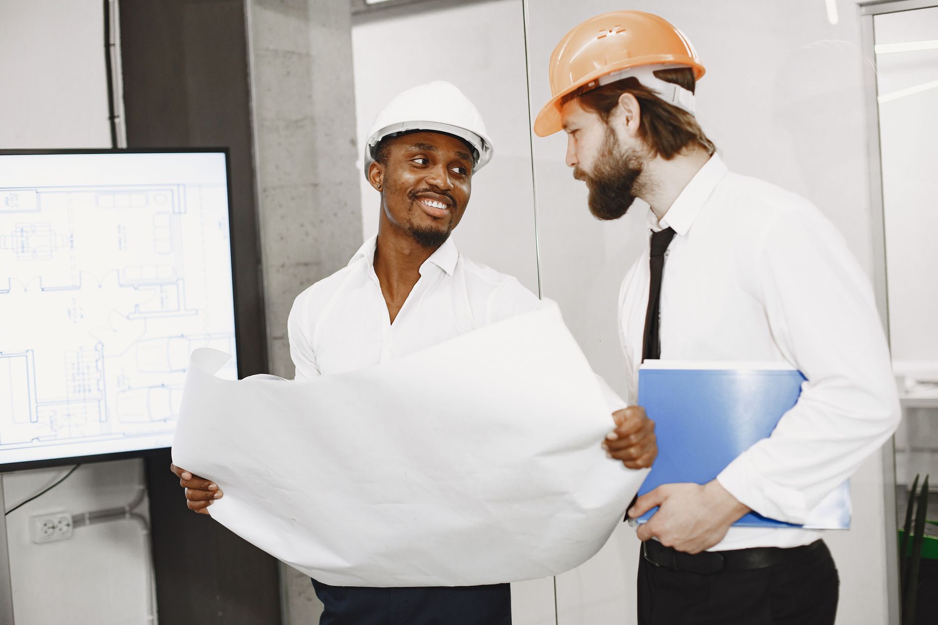 Contractor and homeowner reviewing a remodeling contract together in Cleveland, Ohio