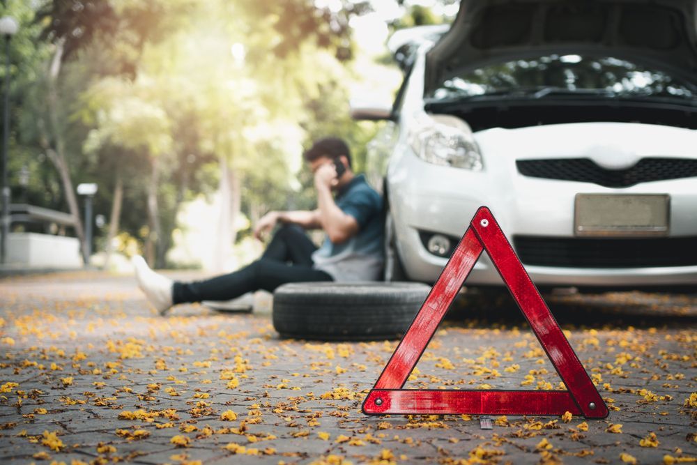 Warning Triangle Beside Broken-down Car on Roadside — Auto Maniac in Mossman, QLD