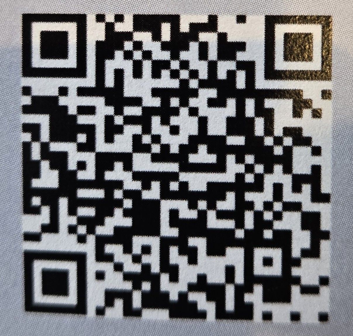 QR code with black and white squares, likely for scanning.