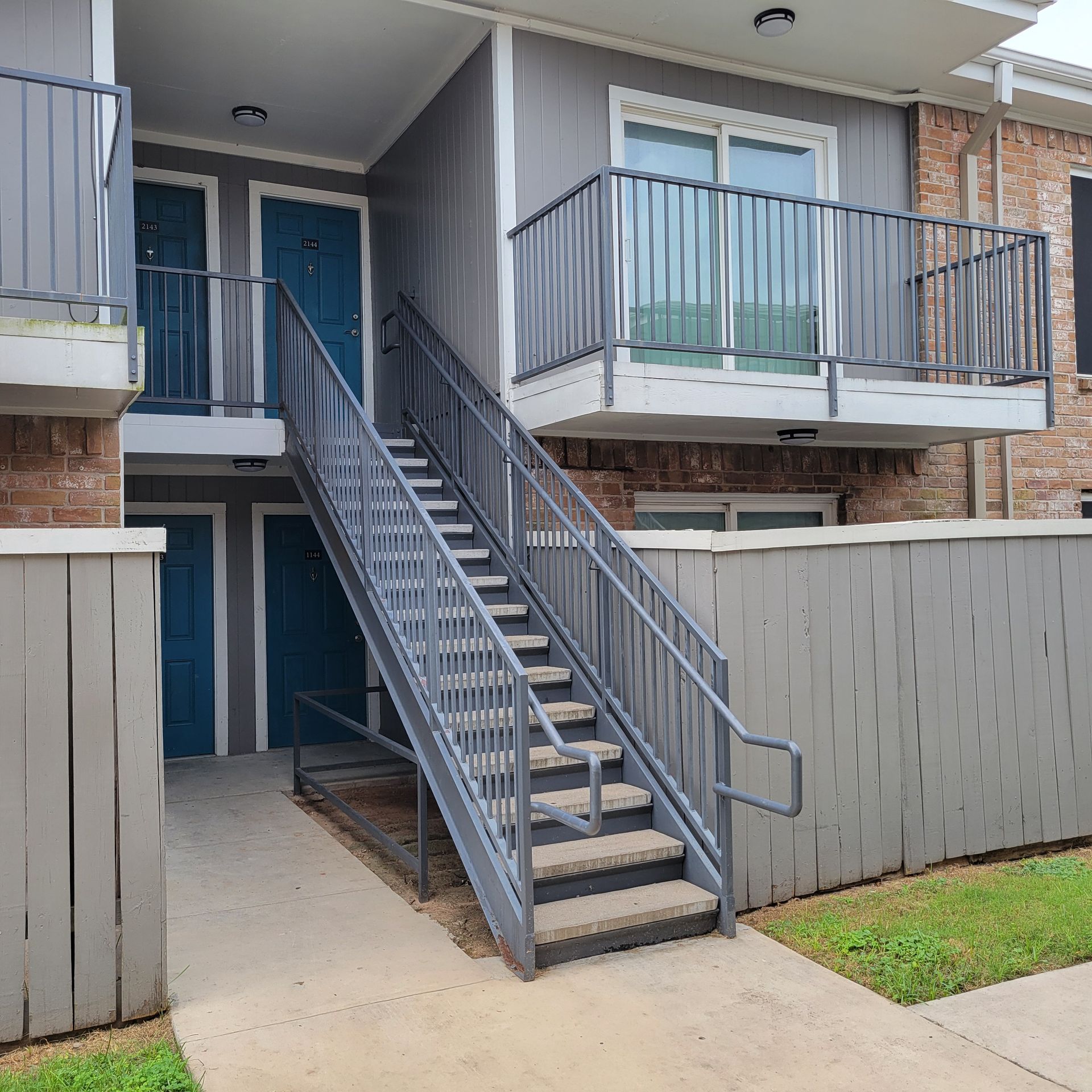 A building with stairs leading up to the second floor