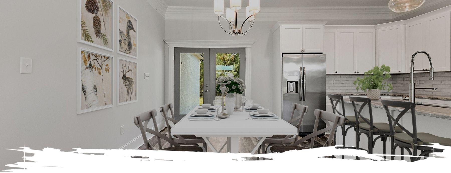 Dining room with a table set for a meal, a kitchen, and four framed pictures on the wall.