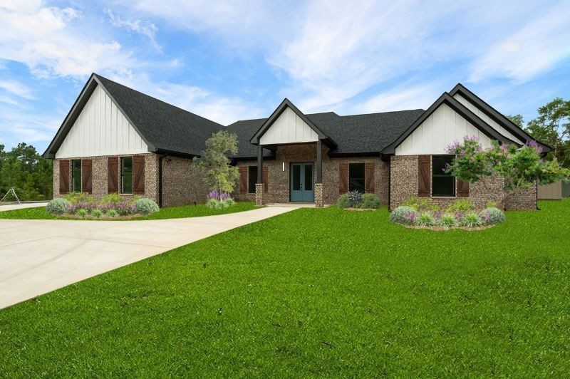 Ranch-style house with brick facade, green lawn, and blue sky. Features white accents, dark shutters, and a driveway.