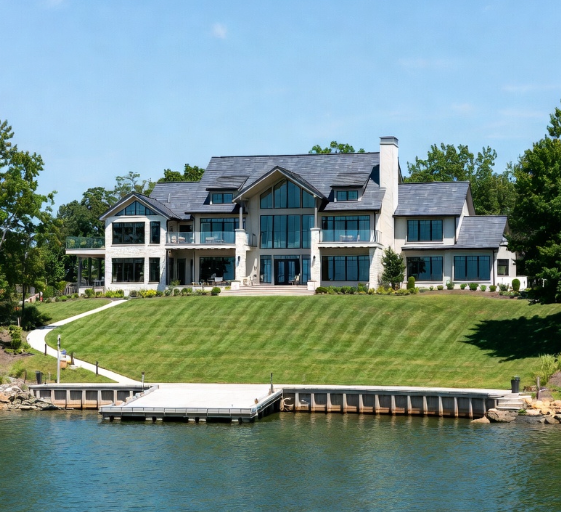 Contemporary two-story lakefront home on Lake Norman featuring extensive glass walls for panoramic water views.