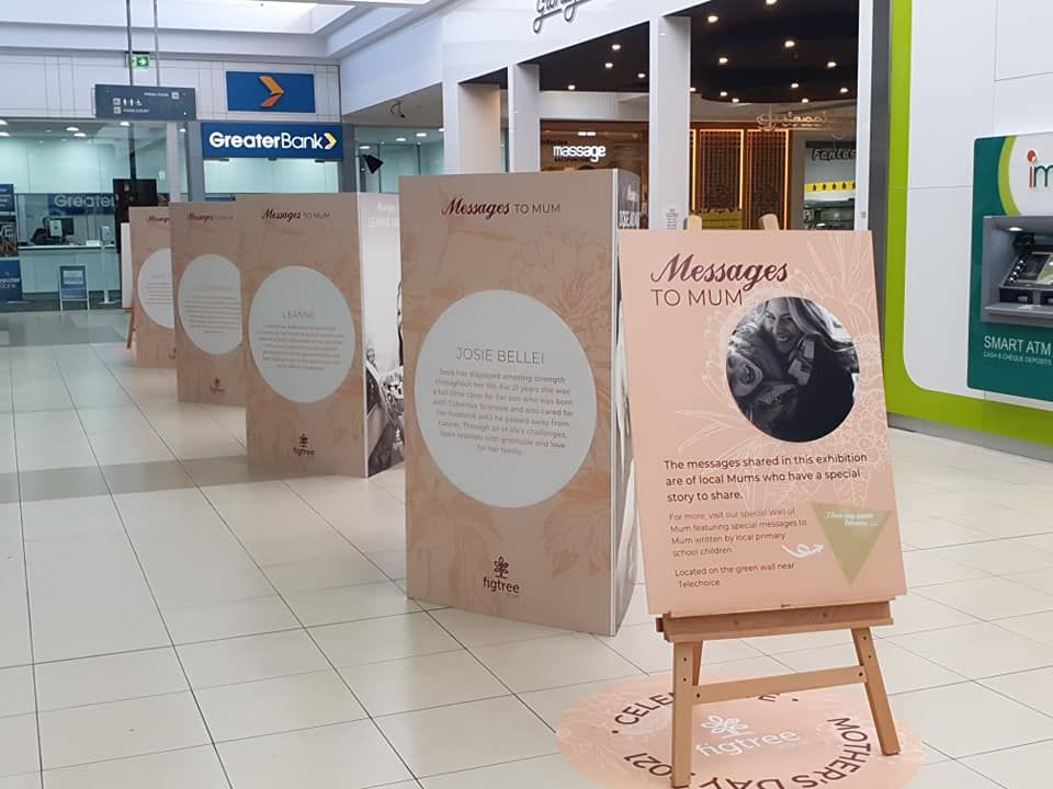 A wooden easel with a sign that says massages to you-Professional Signwriter in the Illawarra