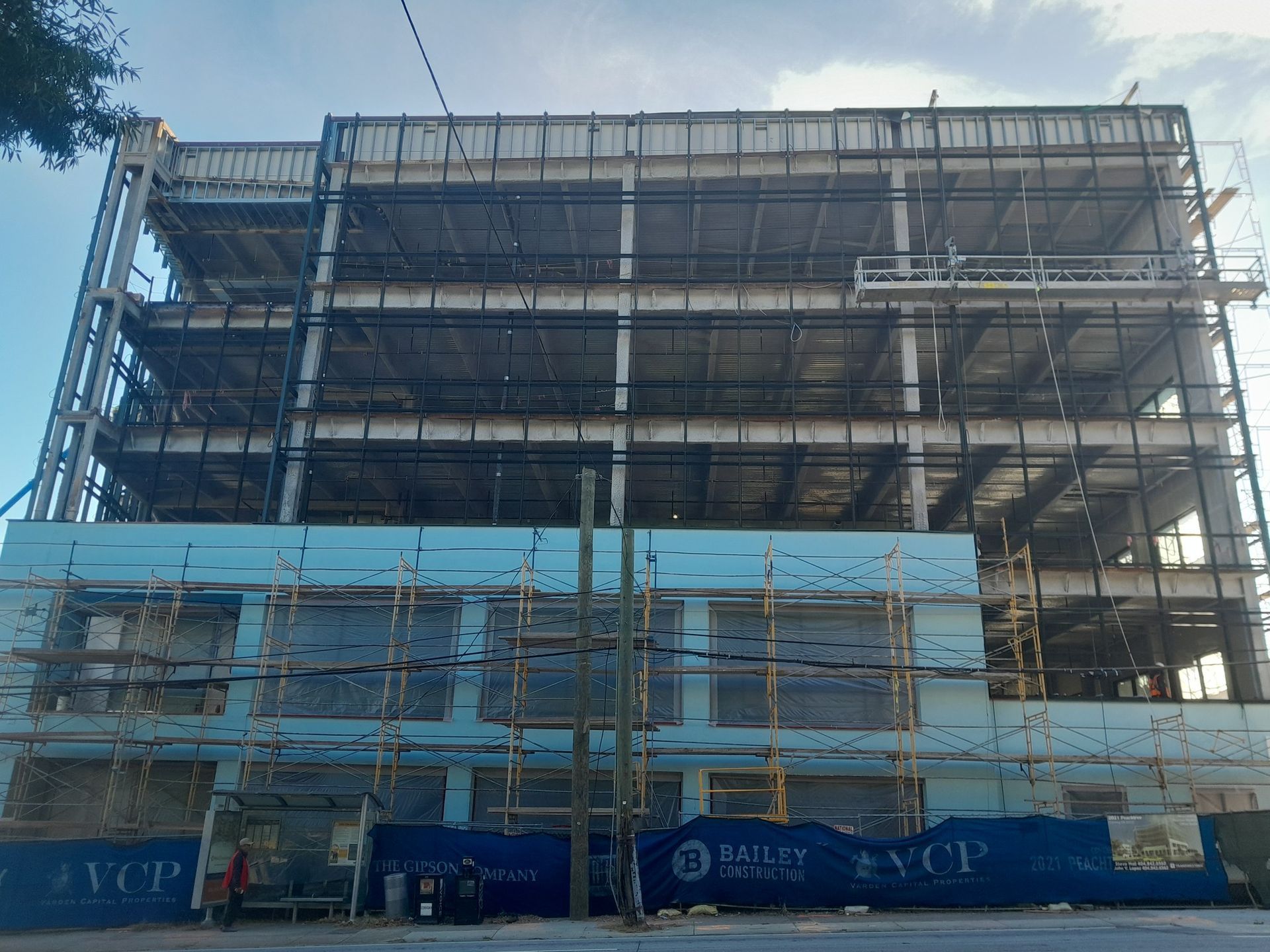 A large building under construction with the word ycp on the side