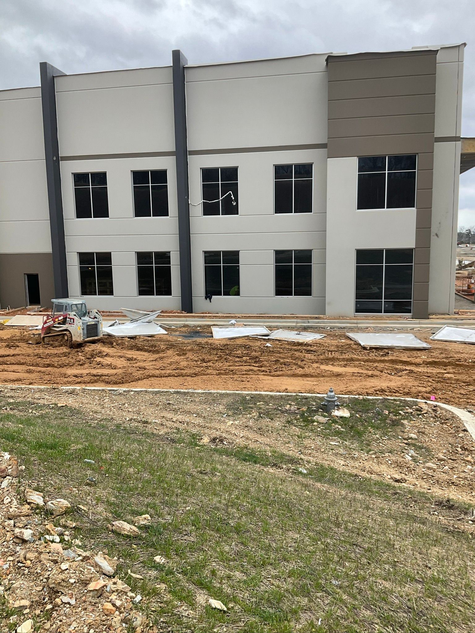 A large building with a lot of windows is being built.