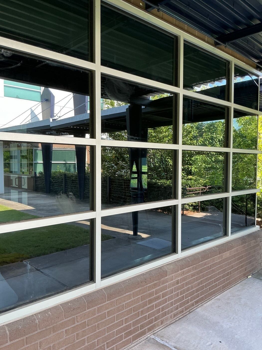 Commercial glass storefront exterior with aluminum framing at Lanier Technical College in Griffin, GA.