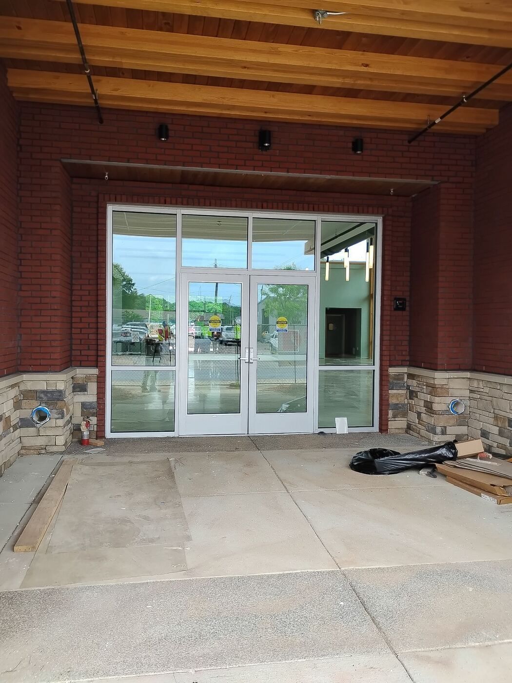 Commercial glass storefront entrance with aluminum framing at Lankford Corner in Griffin, GA.