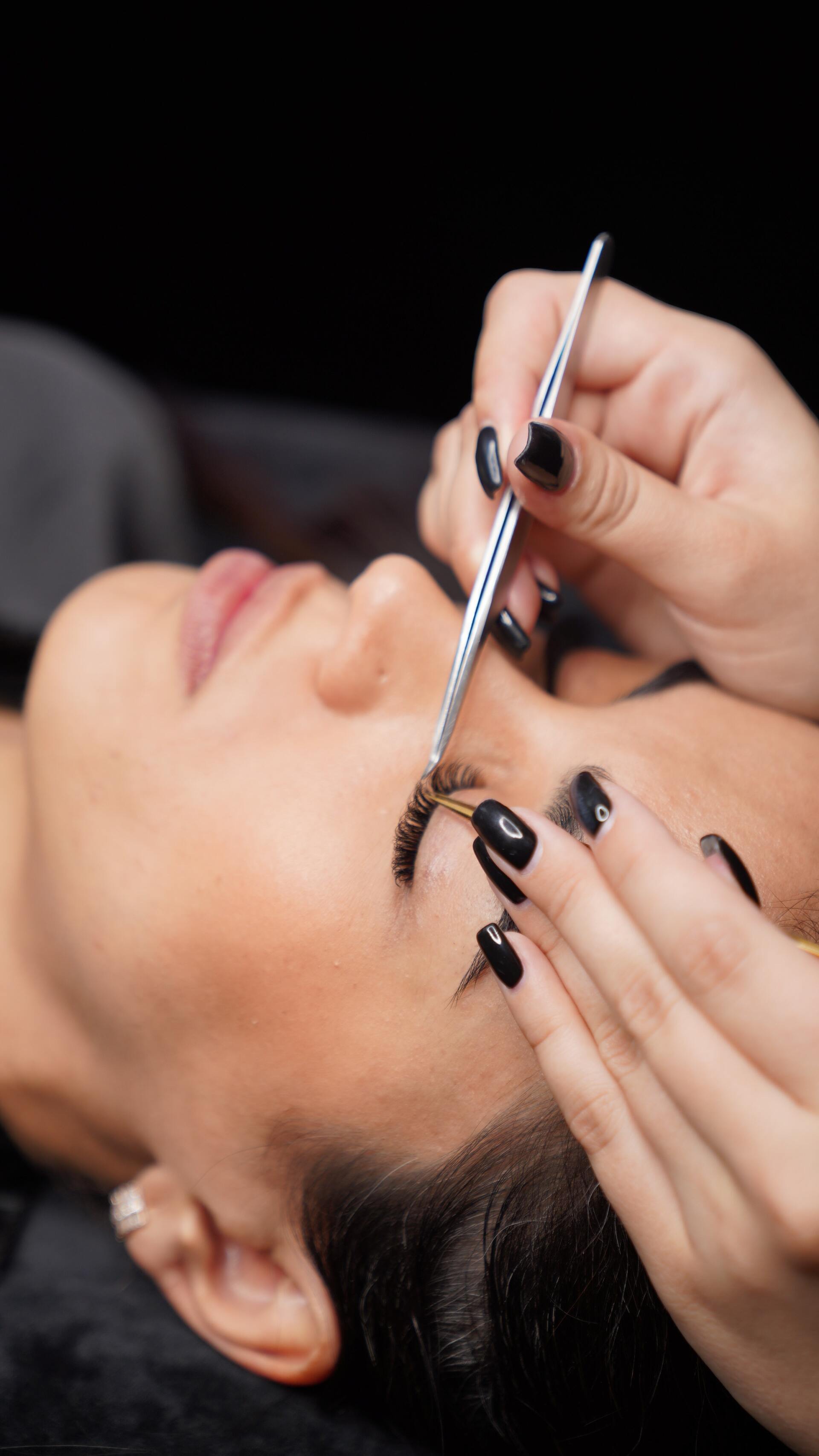 Photo of a woman with eyelashes and eyebrows done