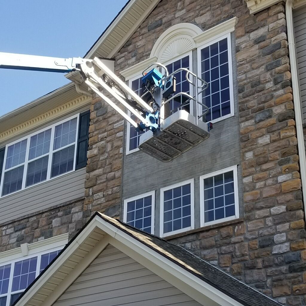 A lift is used to work on a building's exterior.