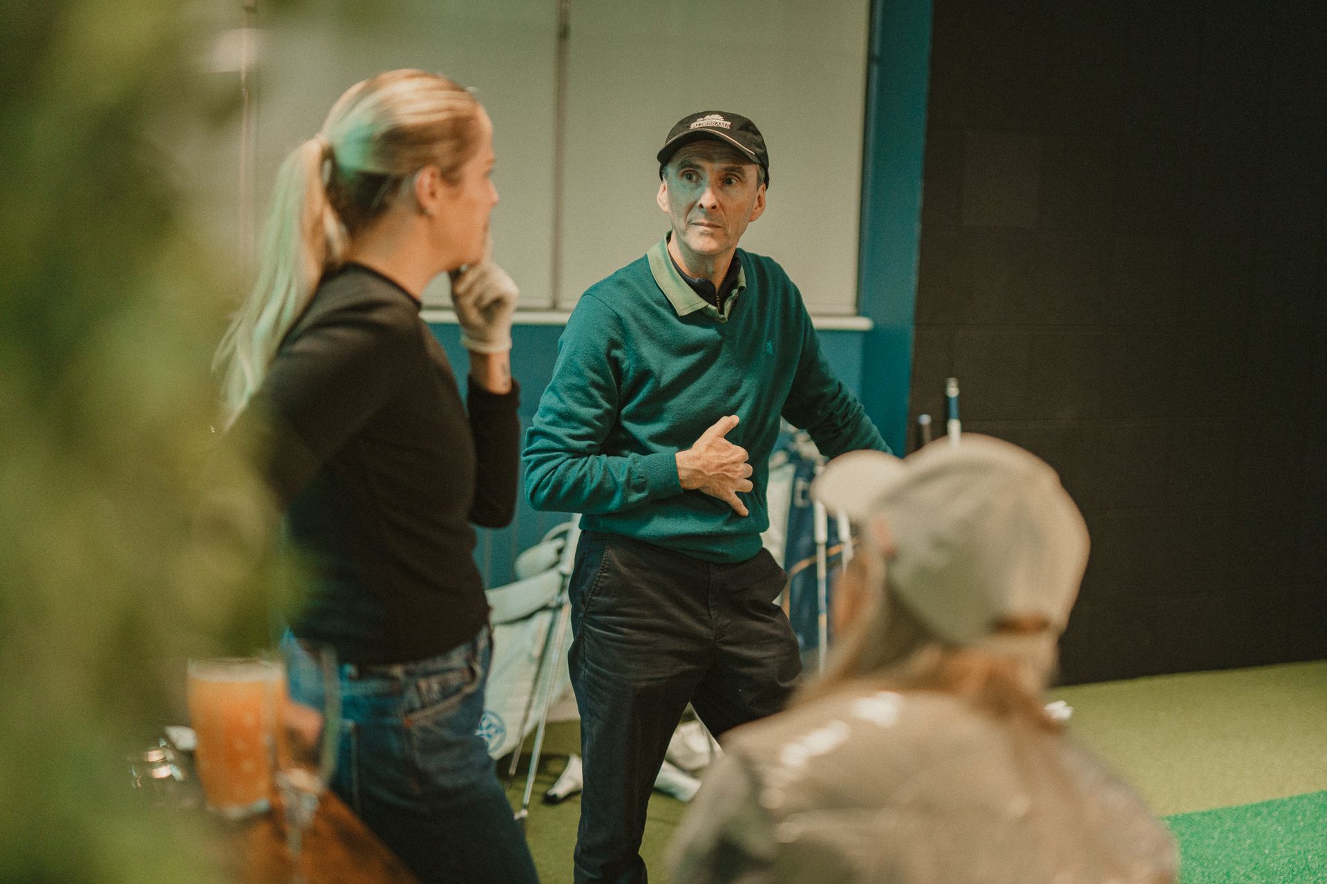 Three members talking discussing golf