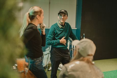 Three members talking discussing golf