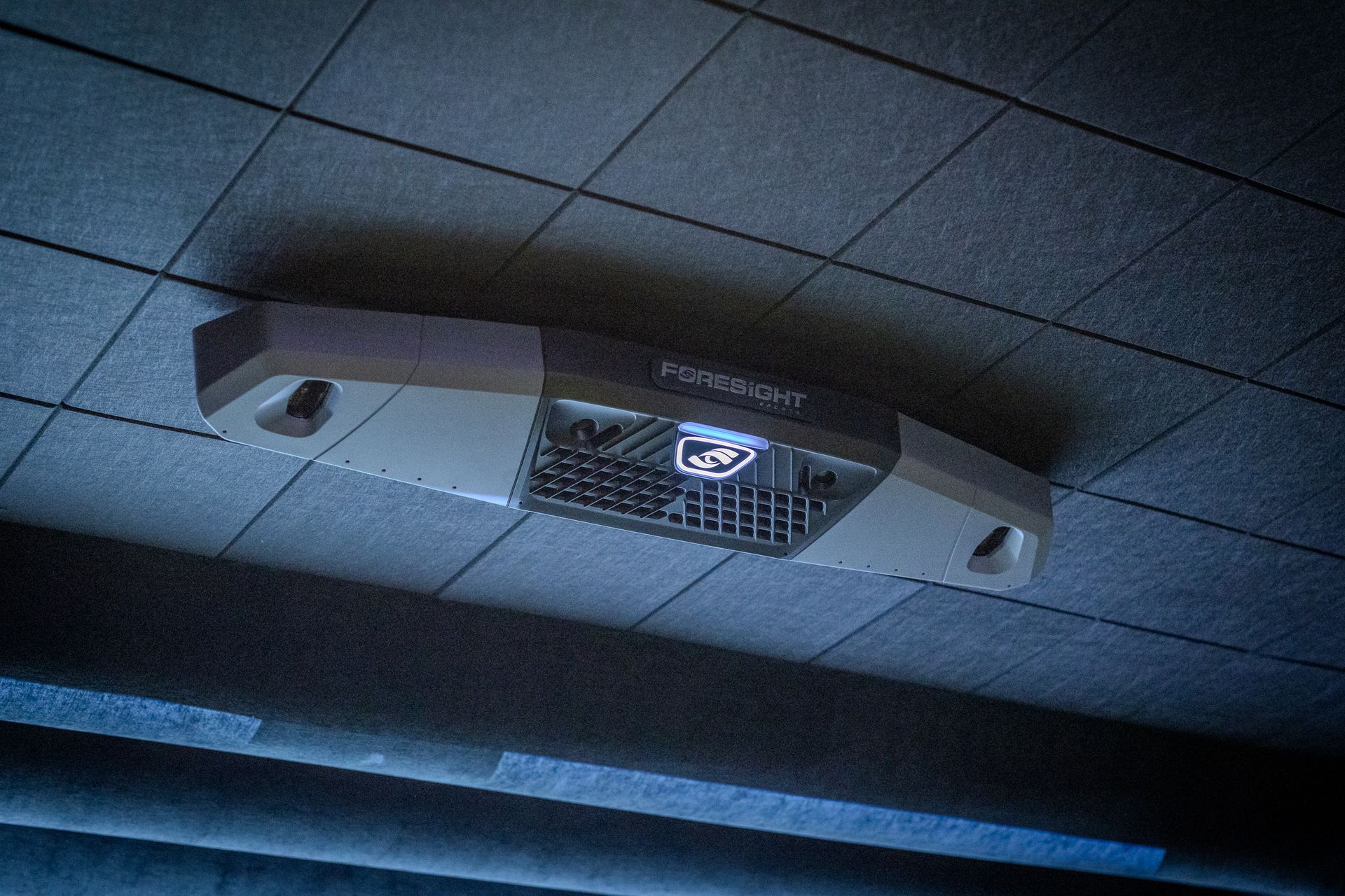 Fluorescent ceiling light fixture with the word 