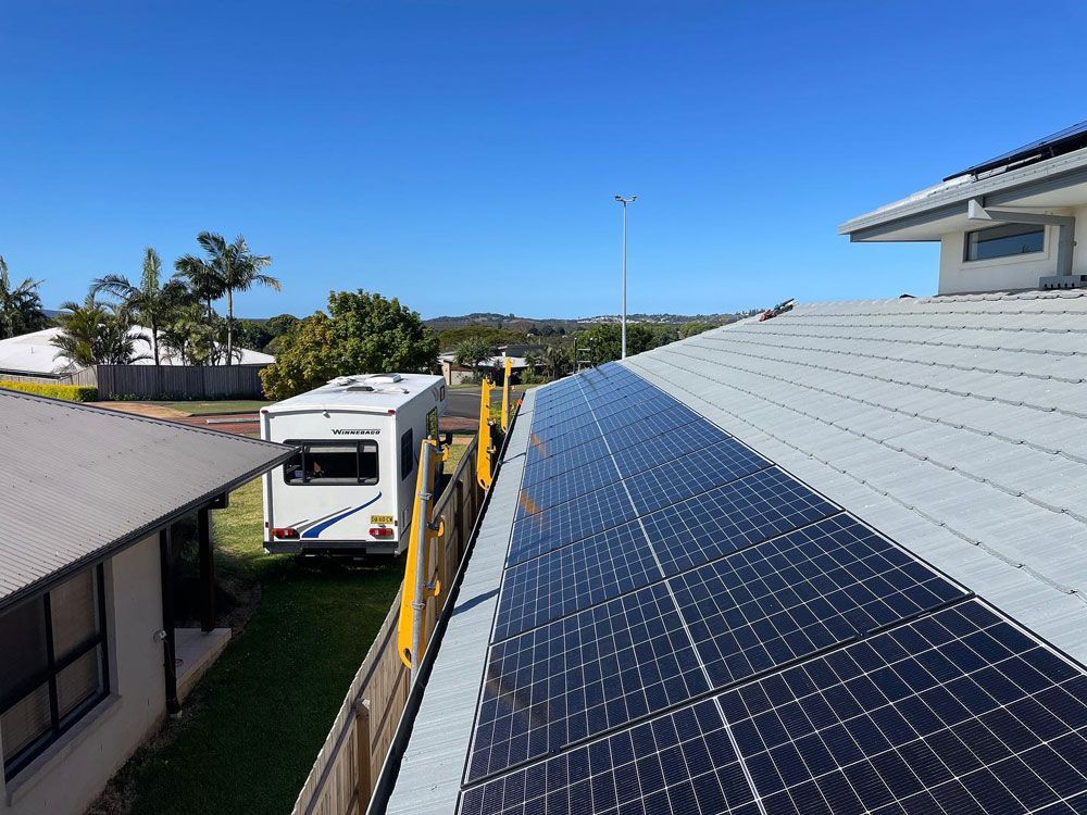 A House With a Lot of Solar Panels Installed on the Roof — Ocean Air Electrical in Ballina, NSW