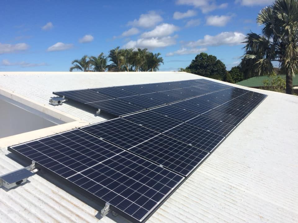 Multiple Solar Panels on a White Roof — Ocean Air Electrical in Ballina, NSW