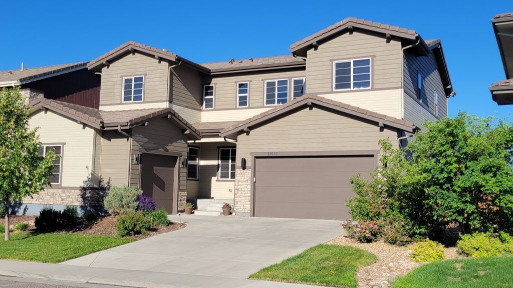 A large house with a garage and a driveway