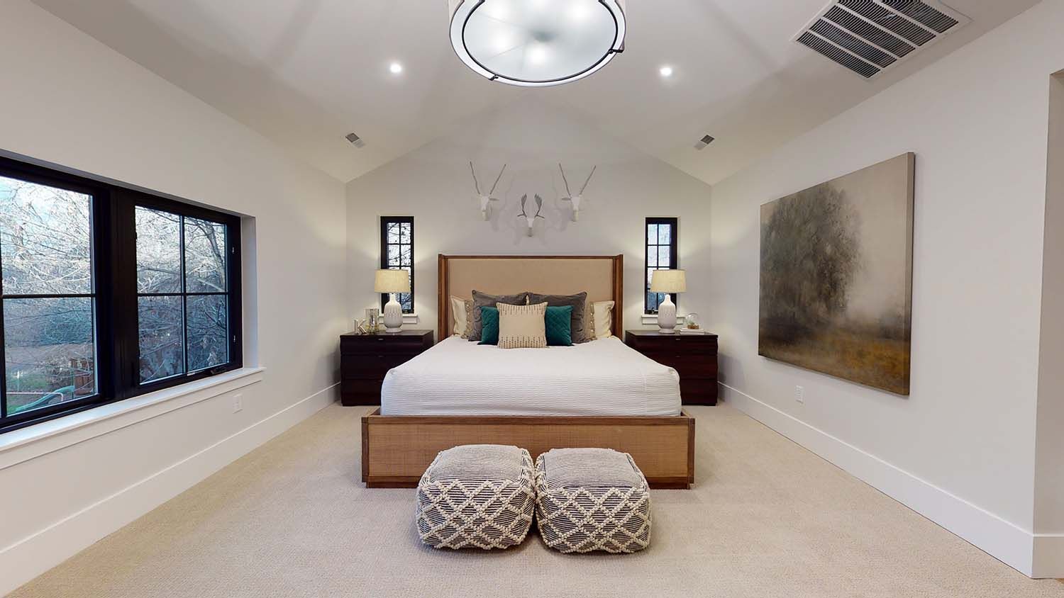 There is a large bed in the middle of the room.