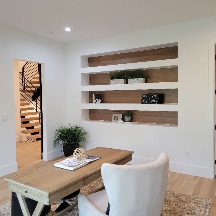 A living room with a coffee table and a chair