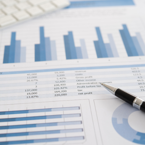 A pen is sitting on top of a financial report
