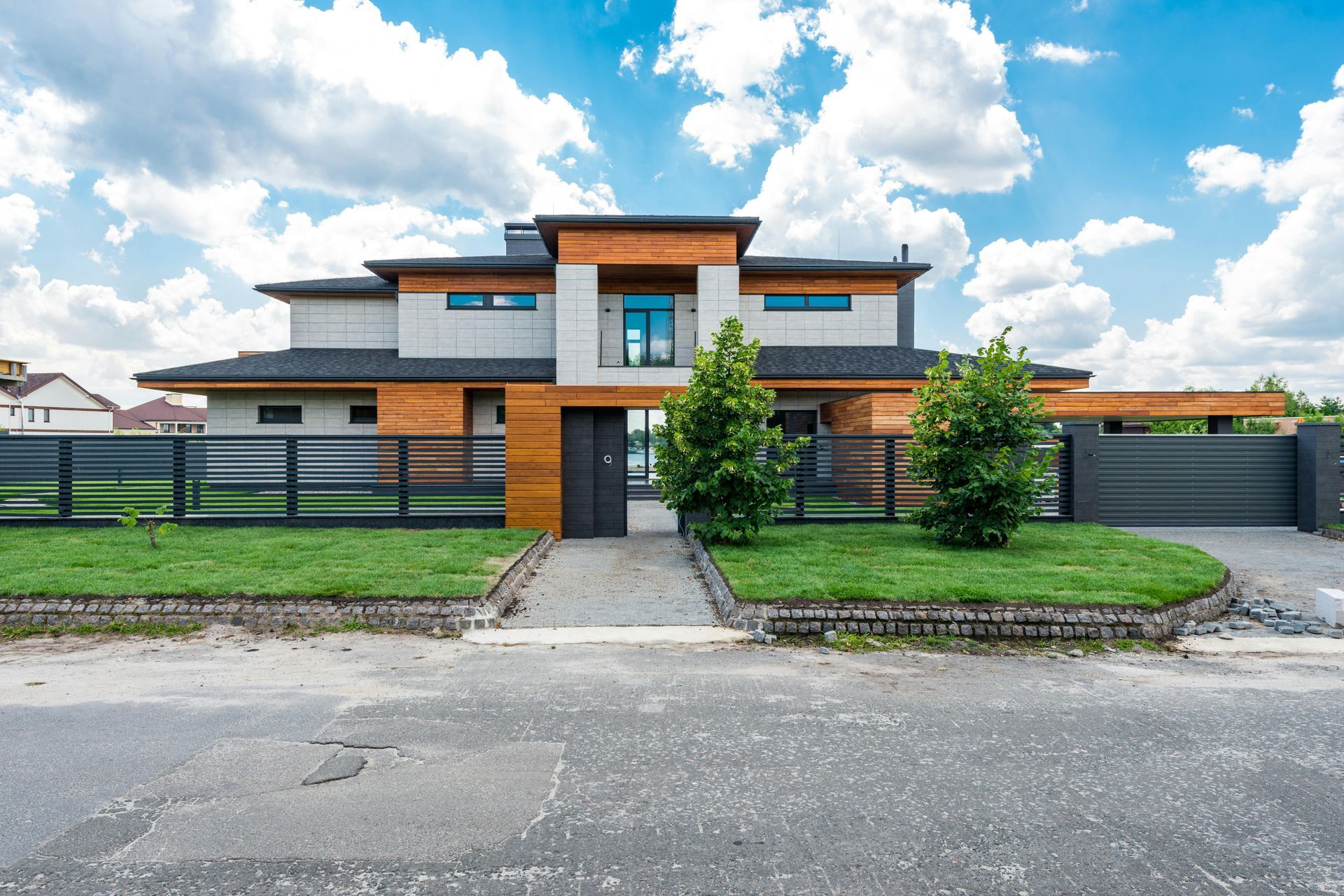 A modern home features sleek fencing installed by expert fencing contractors.