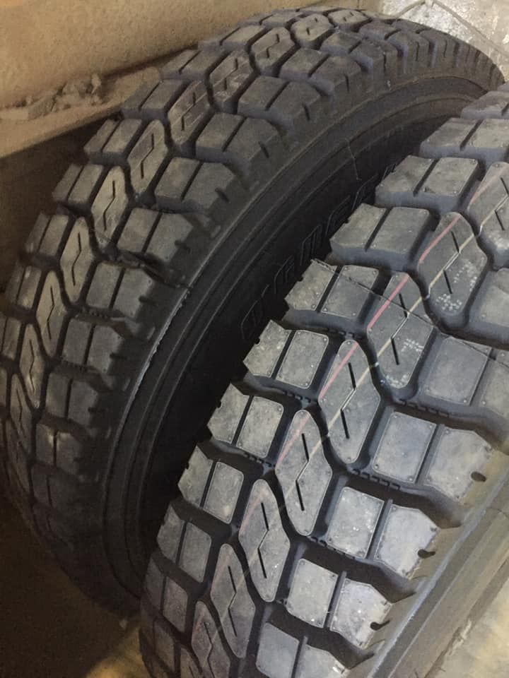 Two Black Truck Tires With Deep Block Tread Patterns — Mid North Coast Heavy Vehicle Repairs In Lake Cathie, NSW