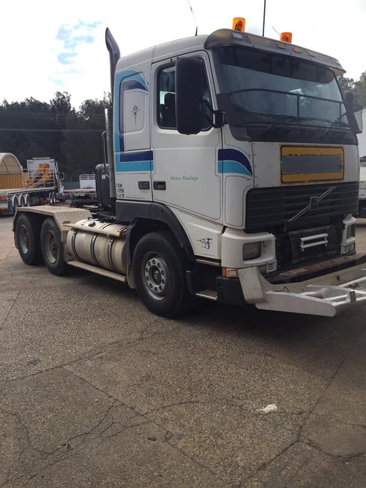 A White Volvo Semi-truck Parked on an Asphalt Lot — Mid North Coast Heavy Vehicle Repairs In Kempsey, NSW