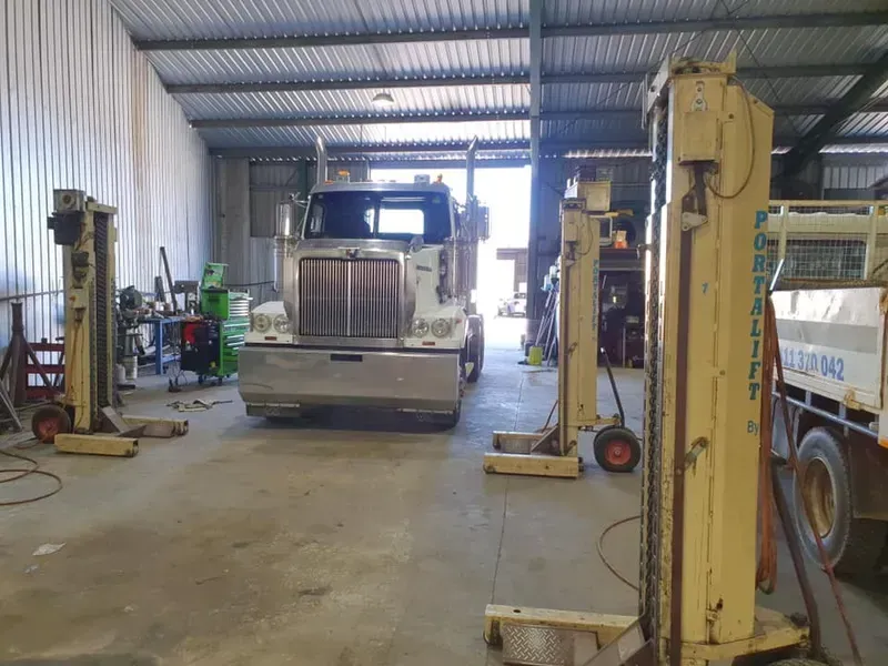 A Large White Semi-truck Parked in an Industrial Garage — Mid North Coast Heavy Vehicle Repairs In Wauchope, NSW